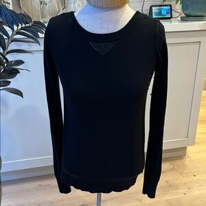 Lululemon Black long sleeve sweater with wrap back open to button at hem
